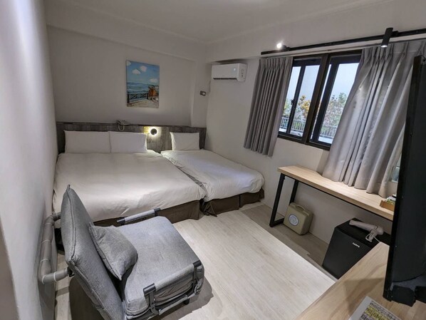 Family Triple Room, 1 Bedroom, City View | Down duvets, individually decorated, desk, laptop workspace