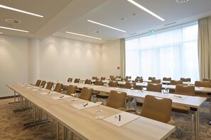 A conference room with long tables, chairs, and glassware. - elaya hotel kleve, Trademark Collection by Wyndham (Kleve)