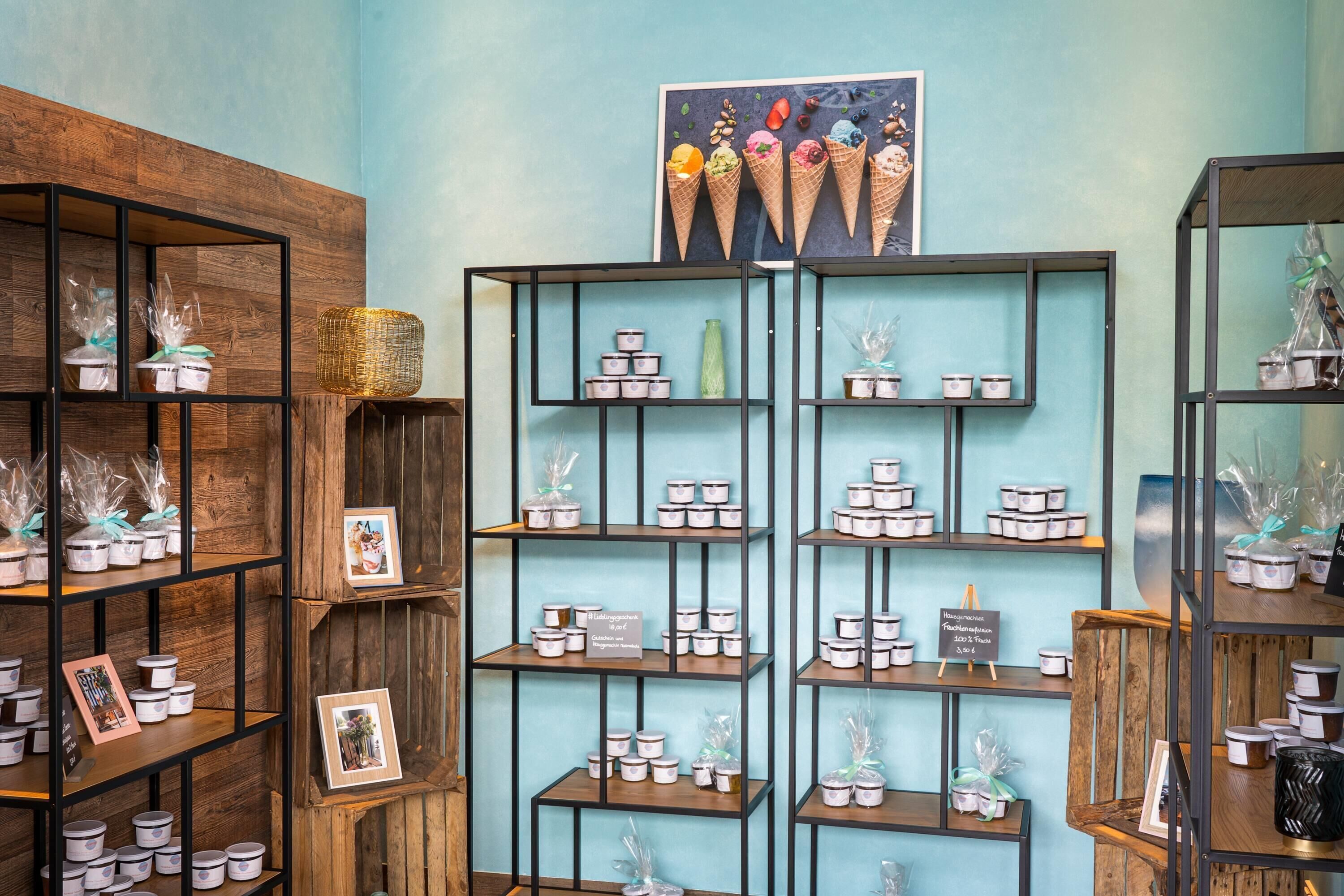 A store interior with multiple shelves displaying jars and containers, some with price tags.