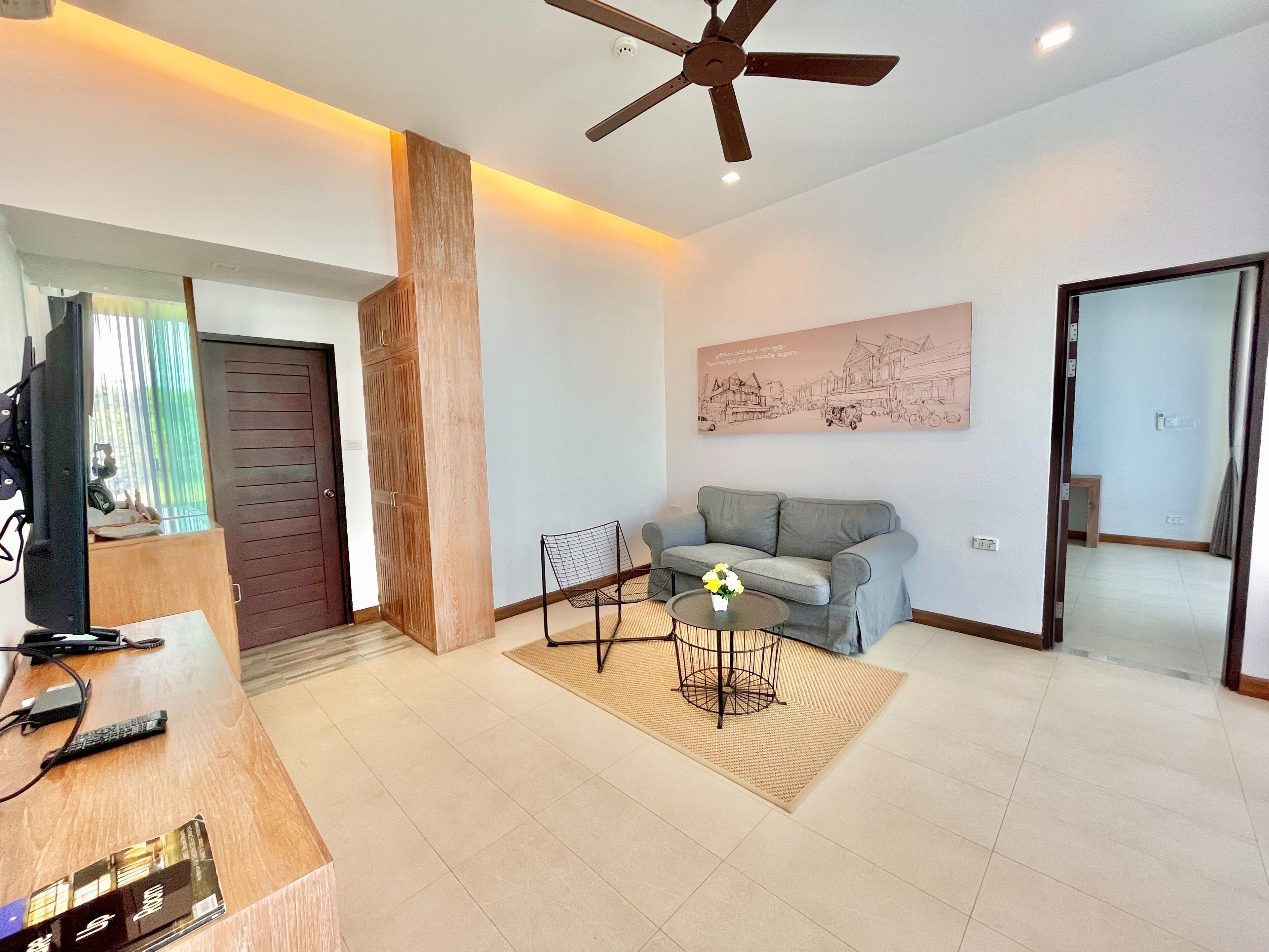 1 bedroom deluxe | living area | 42-inch led tv with digital channels, tv