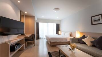 Studio Suite | Living area | 32-inch LCD TV with satellite channels, TV, DVD player