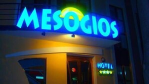 A hotel named 'MESOGIOS' with a neon sign, a visible entrance, and a rating of 3 stars. - Mesogios Hotel (Chisinau)