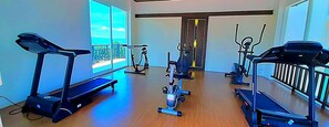 A gym with treadmills, stationary bikes, and elliptical machines. - Royal Thai Pavilion Jomtien Boutique Resort (Pattaya)