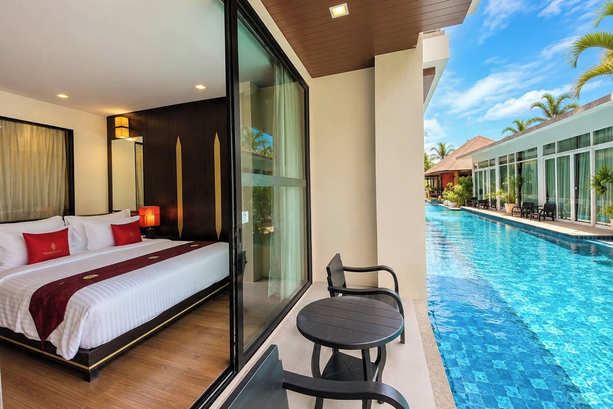 Junior Suite, Pool Access | Minibar, in-room safe, desk, free WiFi