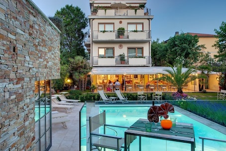 Outdoor pool, a lap pool, open 8:00 AM to 7:30 PM, sun loungers