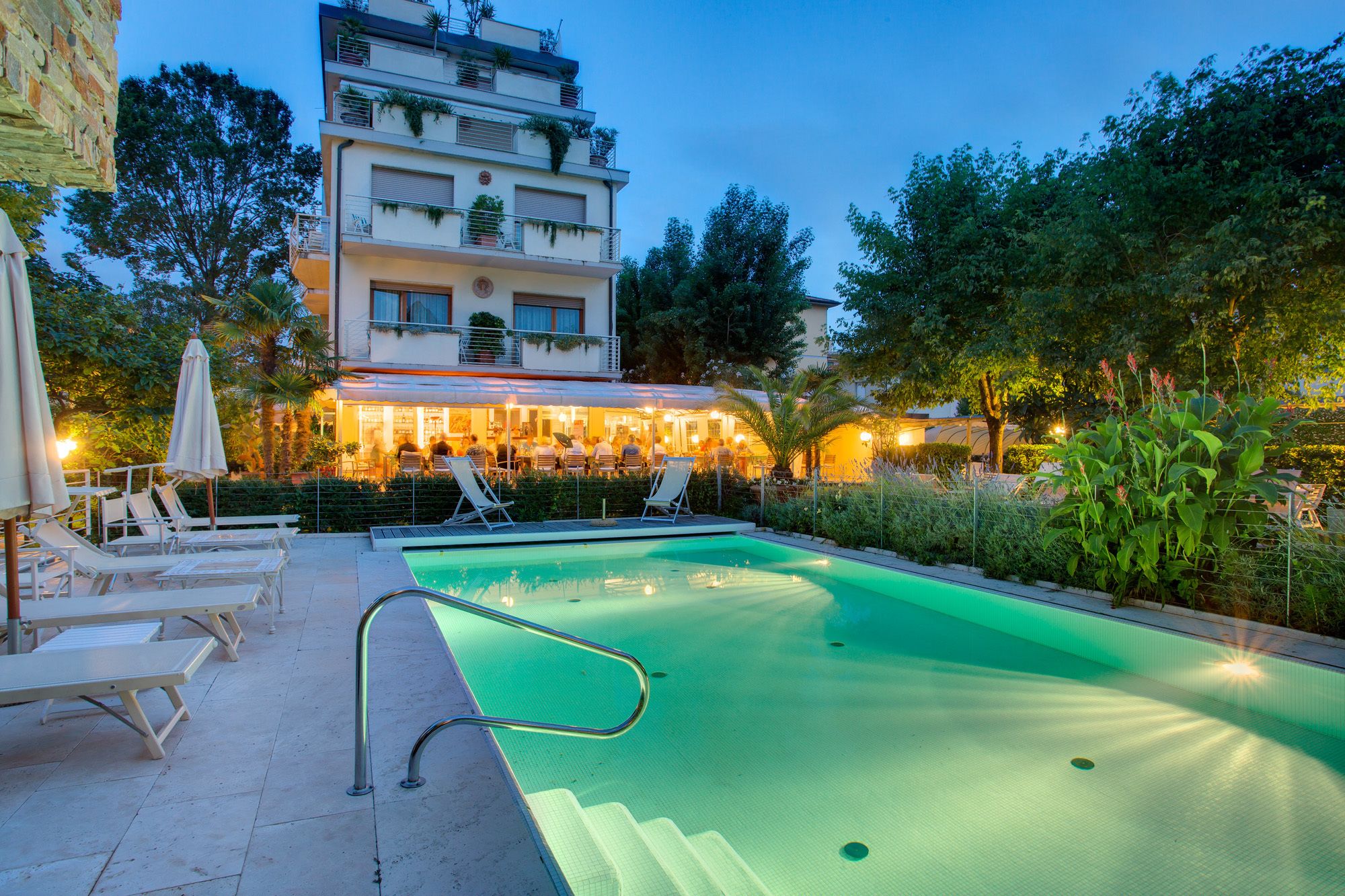 outdoor pool, a lap pool, open 8:00 am to 7:30 pm, pool loungers
