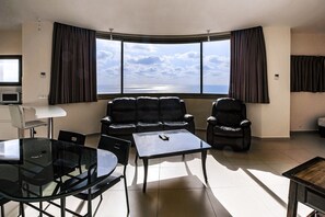 Family Apartment | Living area | 32-inch flat-screen TV with satellite channels, TV