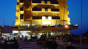 A multi-story hotel with a prominent 'BAIA' sign on the top. - Baia (Rimini)