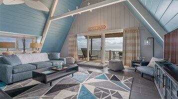 Beach House Suite (2nd floor, stair access only) | Living area | 42-inch flat-screen TV with cable channels, TV