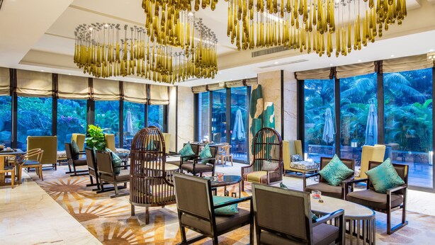 A spacious lobby with modern furniture, large windows, and a unique chandelier. - Crowne Plaza Sanya City Center by IHG (Sanya)