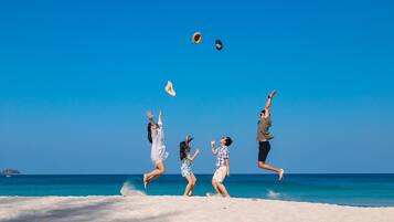 On the beach, white sand, beach towels