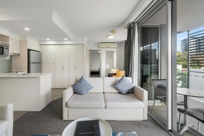 Apartment, 1 Bedroom | Living area | 42-inch flat-screen TV with digital channels, TV