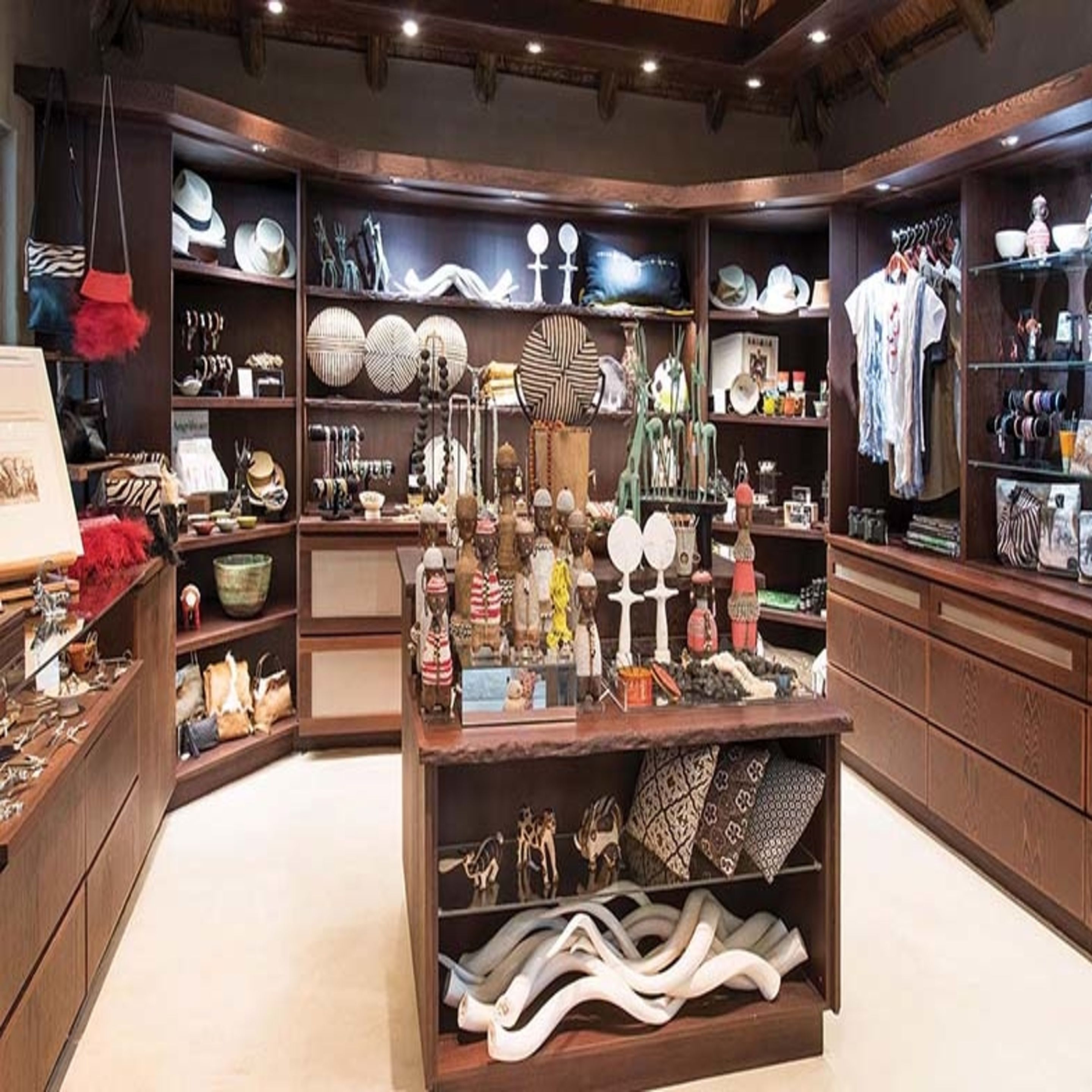 A well-organized boutique with shelves of hats, bags, and accessories.