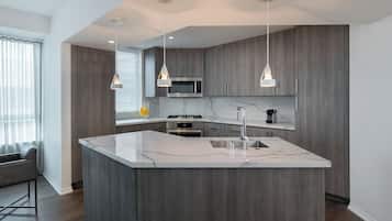 Penthouse, Multiple Beds | Private kitchen | Fridge, microwave, stovetop, dishwasher