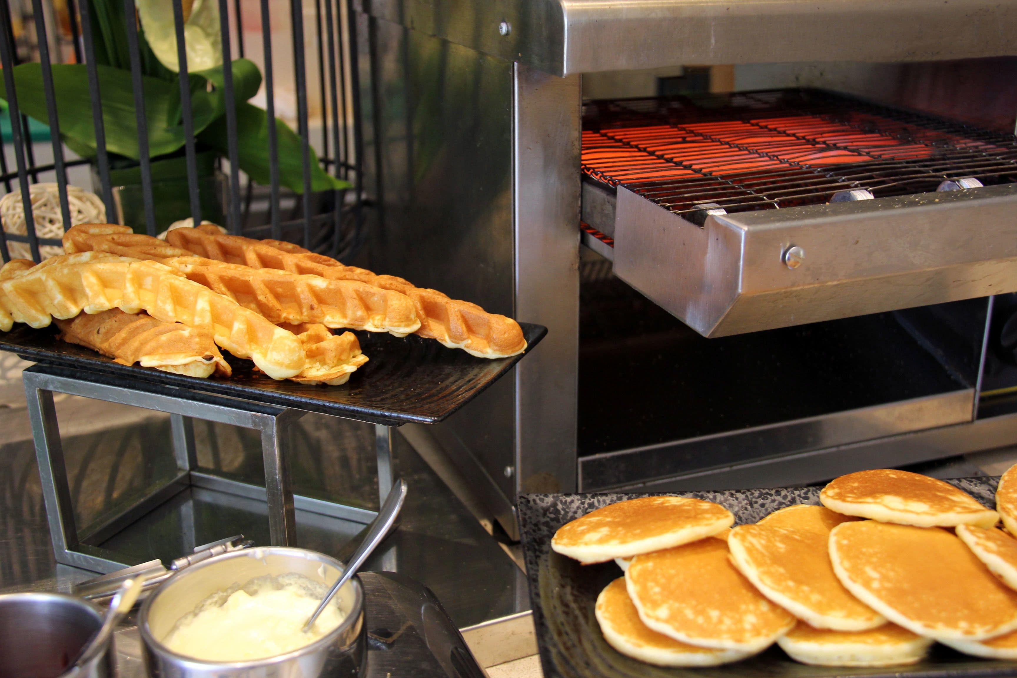 A waffle iron with waffles being cooked.