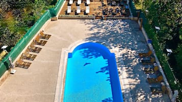 Indoor pool, seasonal outdoor pool, pool umbrellas, pool loungers