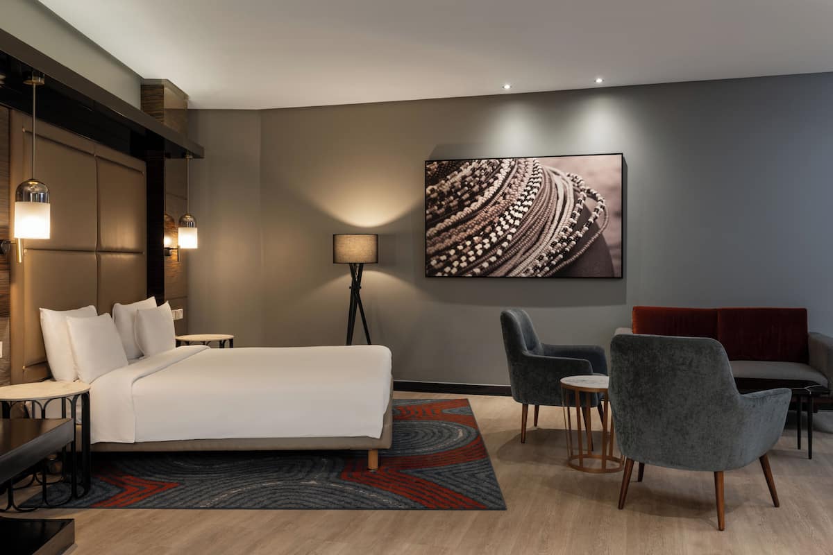 Habitación ejecutiva | Ropa de cama de alta calidad y minibar