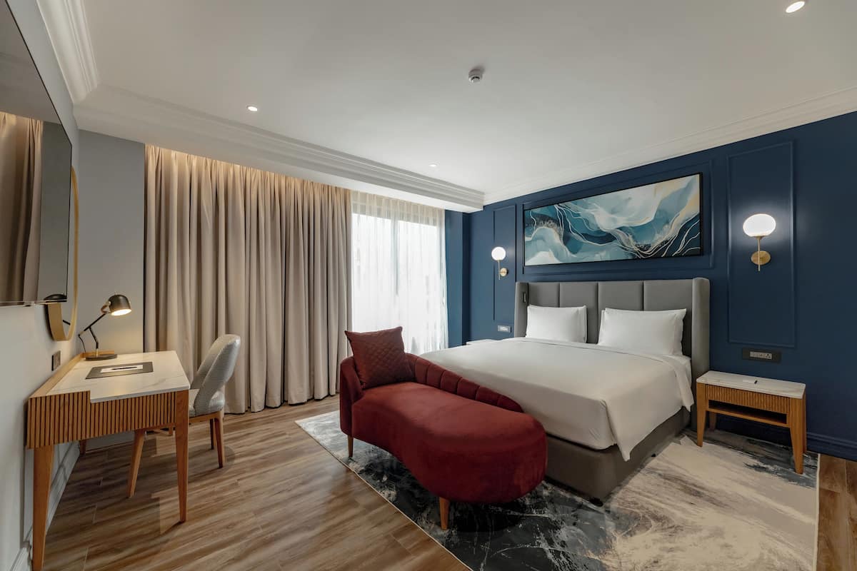 Suite Présidentielle | Literie de qualité supérieure, minibar, coffres-forts dans les chambres