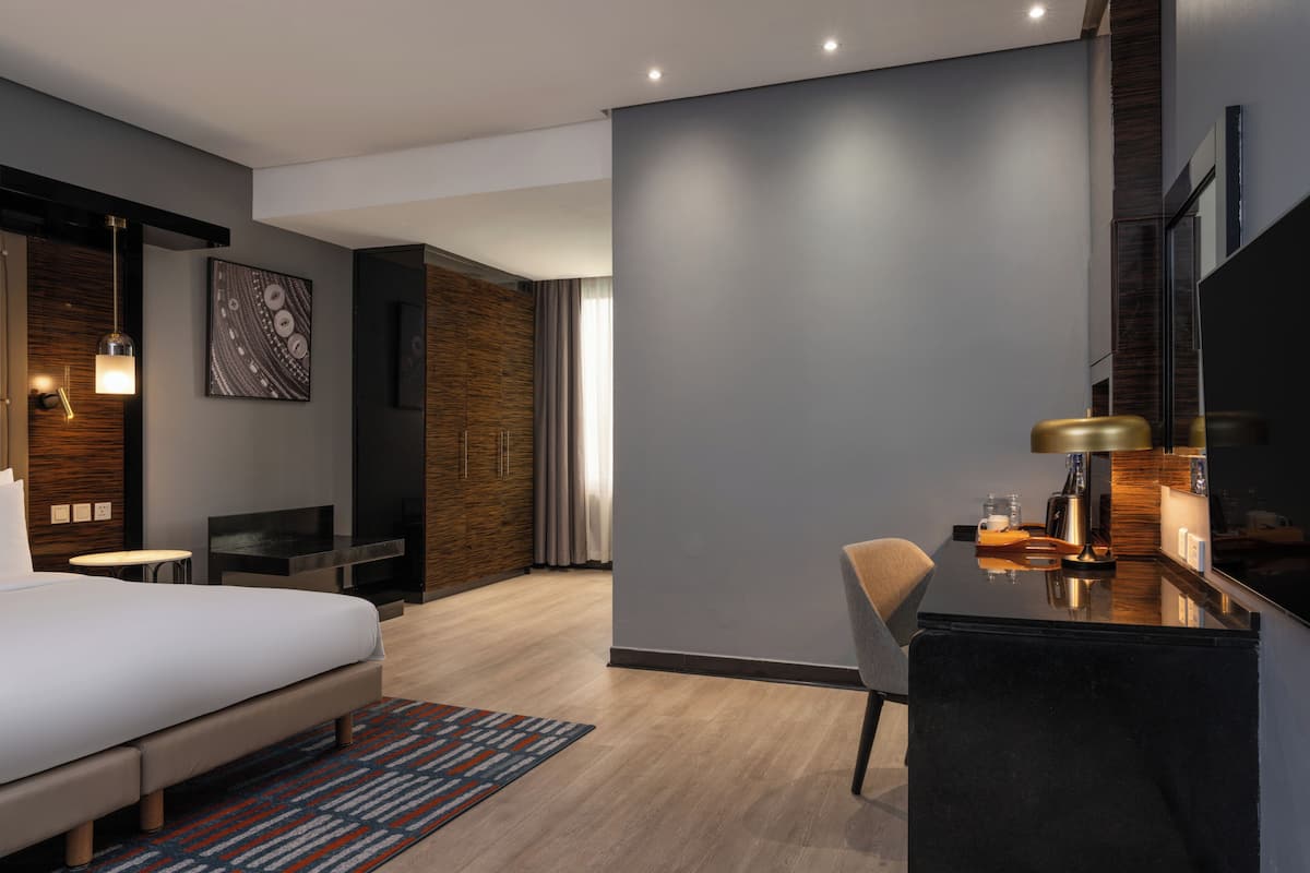 Habitación superior | Ropa de cama de alta calidad y minibar