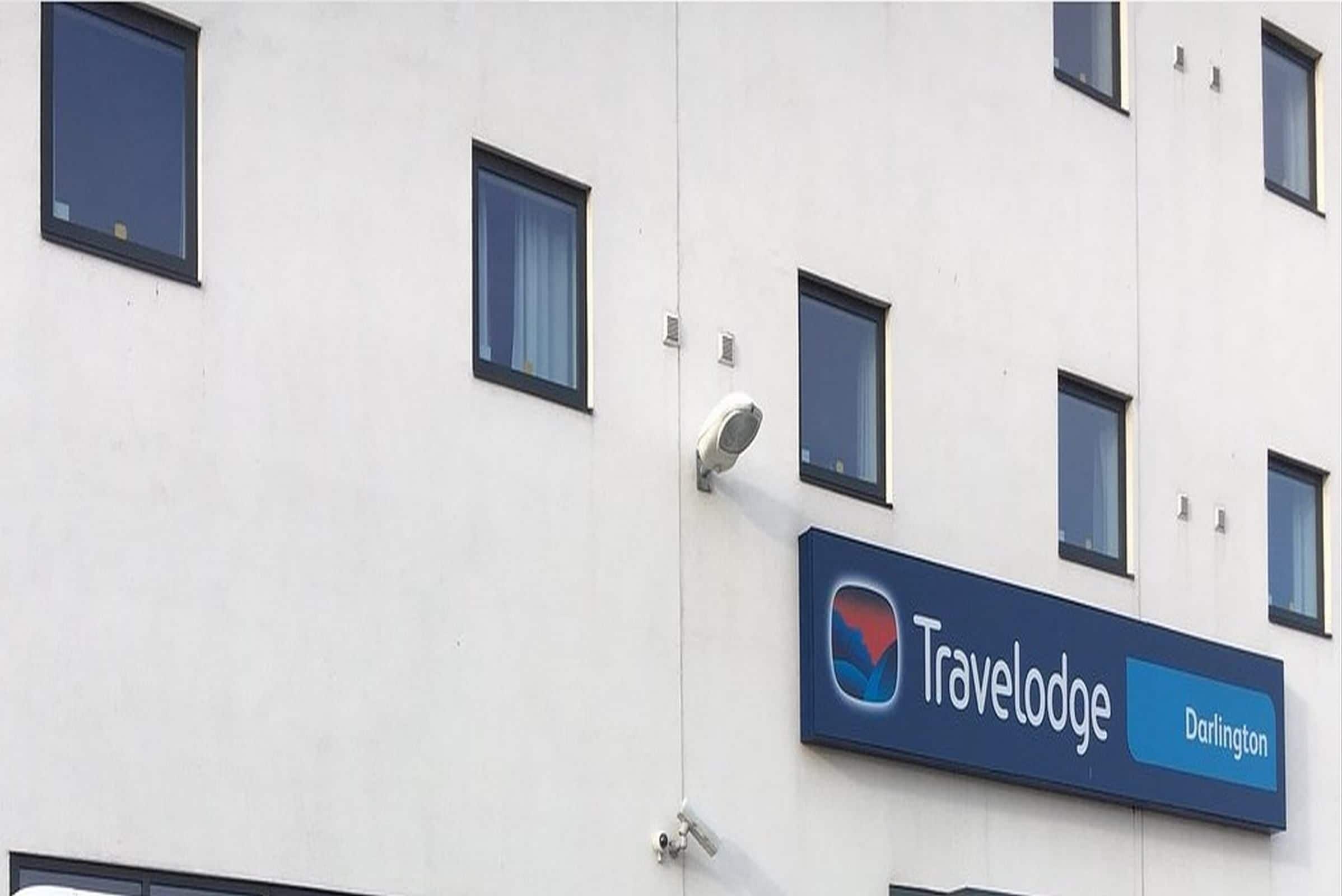 A Travelodge sign on a building.
