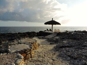 Private beach, white sand, sun loungers, beach towels