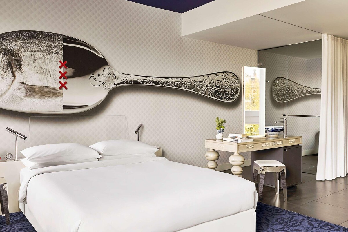 Hypo-allergenic bedding, down duvets, free minibar items, in-room safe