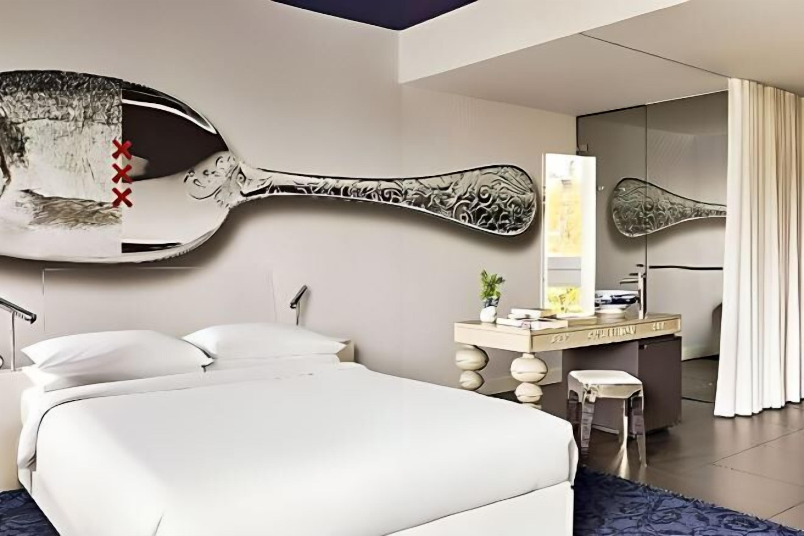 Hypo-allergenic bedding, down duvets, free minibar items, in-room safe