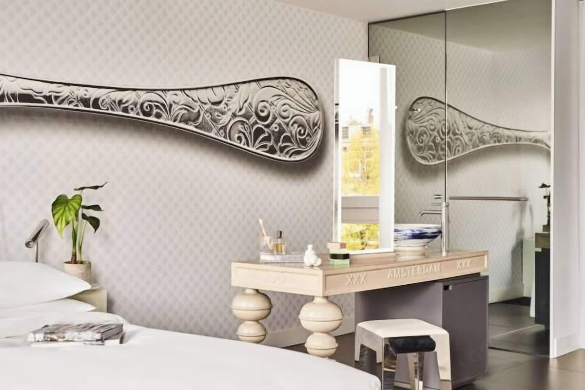 Hypo-allergenic bedding, down duvets, free minibar items, in-room safe