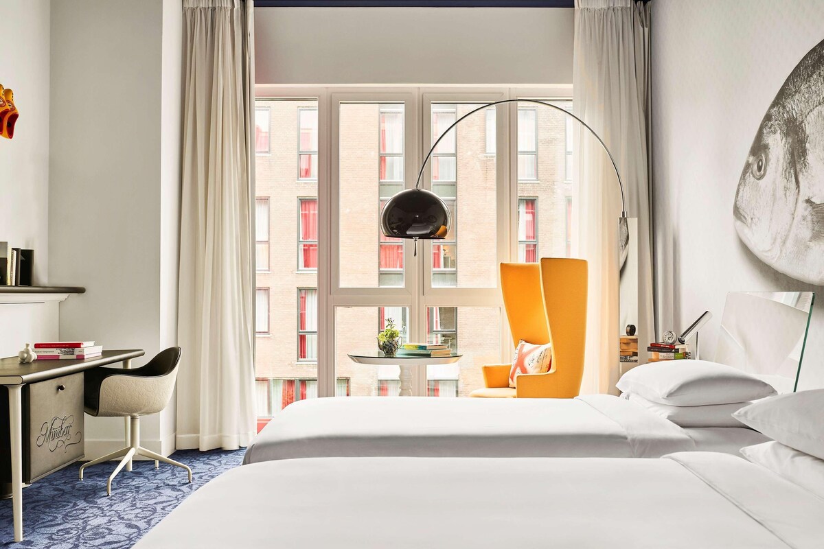 Hypo-allergenic bedding, down duvets, free minibar items, in-room safe