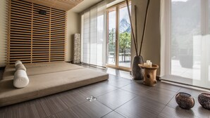 A modern room with a tatami mat seating area, large windows, and minimalist decor. - Alpenlodge (Zermatt)