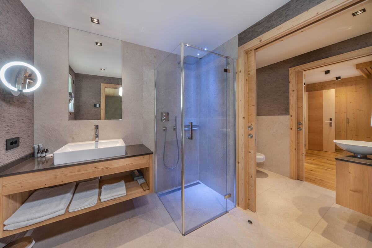 family room, 1 king bed with sofa bed, mountain view | bathroom | shower, free toiletries, hair dryer, bathrobes