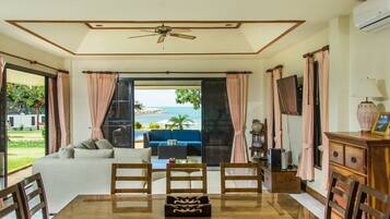 5 Bedrooms Beachfront Exclusive Grand Villa Deluxe | Living area | 42-inch flat-screen TV with satellite channels, TV, DVD player