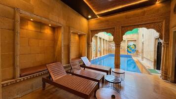 Outdoor pool, open 9:00 AM to 8:00 PM, pool loungers