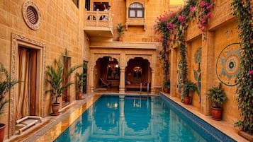 Outdoor pool, open 9:00 AM to 8:00 PM, sun loungers