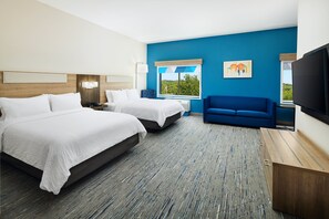 A hotel room with two beds, a blue sofa, a TV, and a window with a view. - Holiday Inn Express & Suites Wheeling by IHG (Triadelphia)