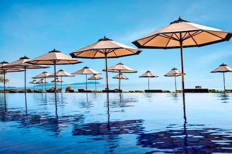 Outdoor pool, open 7:00 AM to 7:00 PM, free cabanas, pool umbrellas