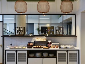 A breakfast buffet with pastries, Nutella, and condiments. - Aparthotel Adagio Liverpool City Centre (Liverpool)