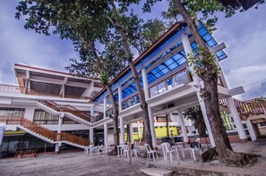 A multi-level building with outdoor seating areas and staircases. - Apple Tree Resort and Hotel (Opol)