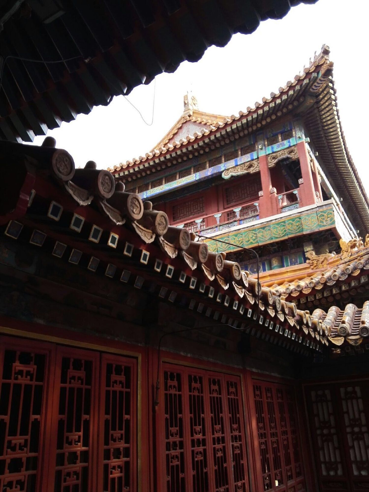 A traditional building with a multi-tiered roof and ornate decorations.