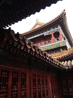 A traditional building with a multi-tiered roof and ornate decorations.