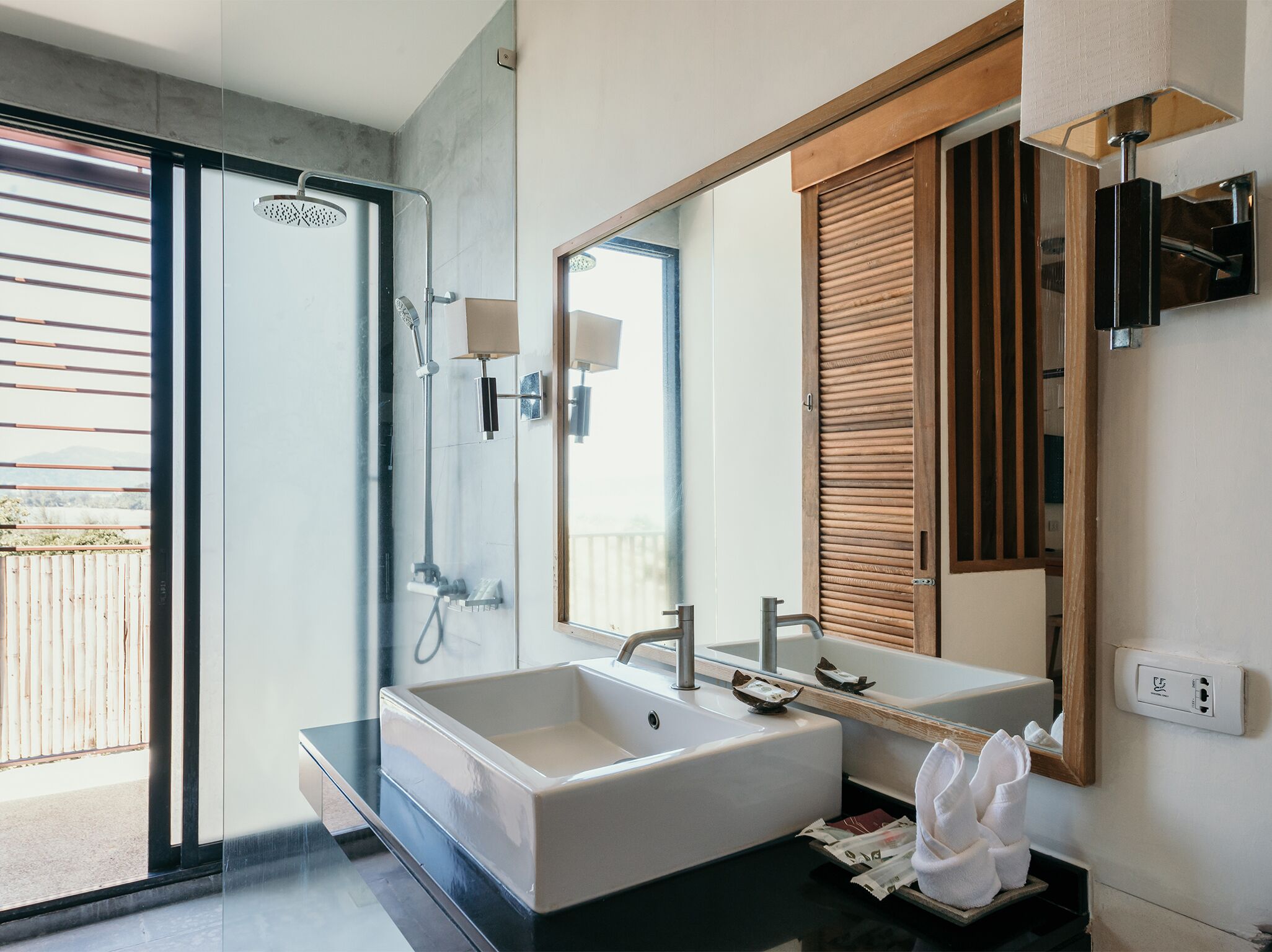 studio deluxe building | bathroom | free toiletries, hair dryer, slippers, towels