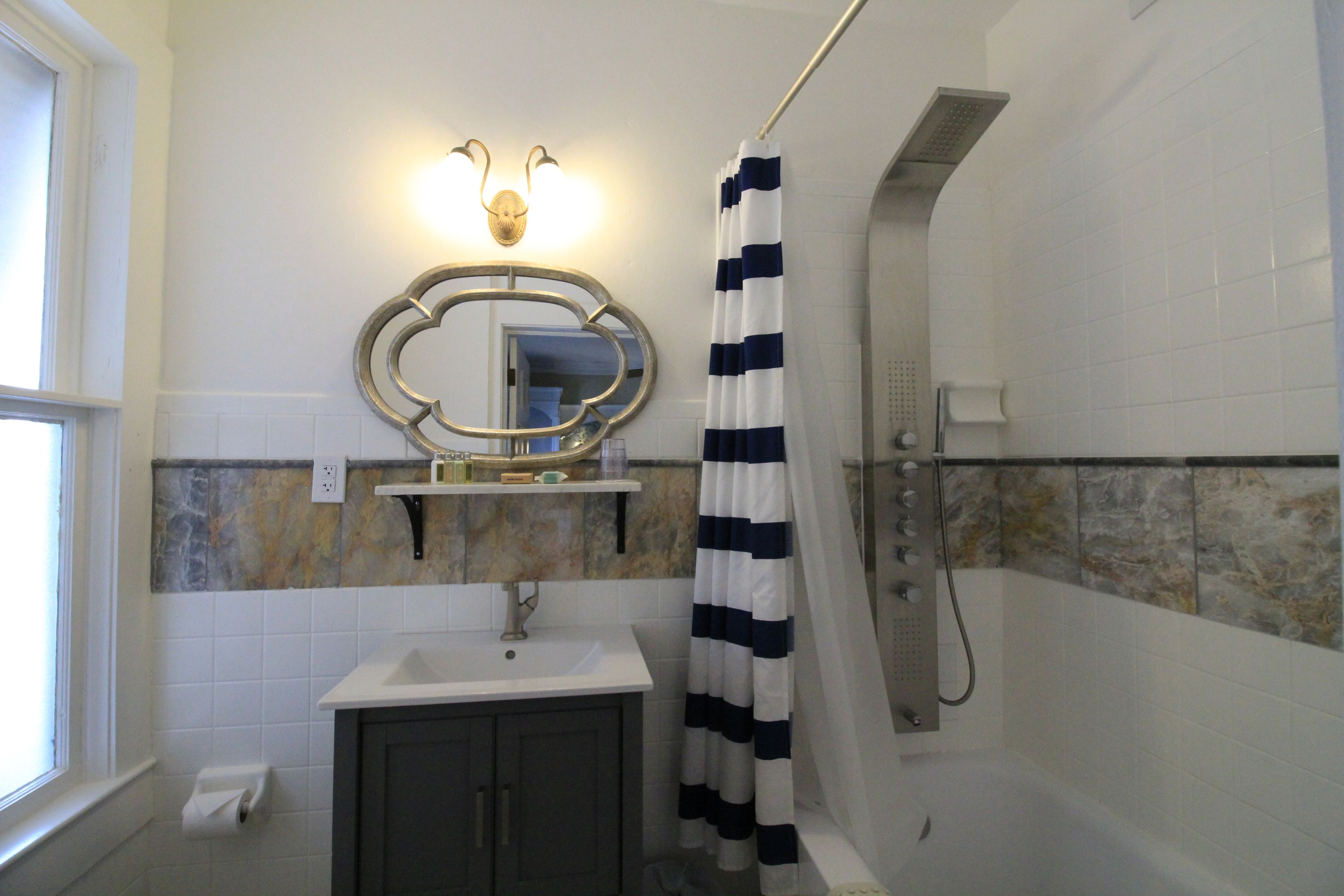 grand suite, river view | bathroom | designer toiletries, hair dryer, bathrobes, towels