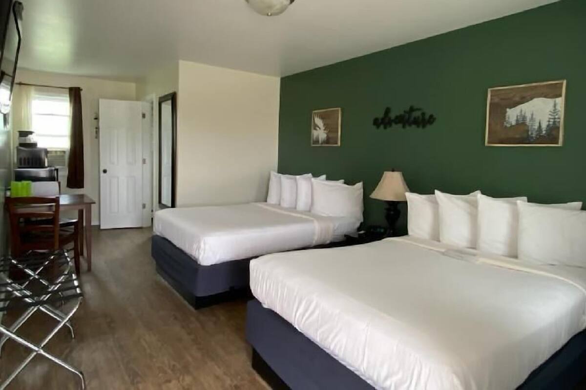 Standard room with two double beds | Individually decorated, cots/infant beds, rollaway beds, free WiFi