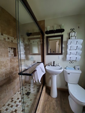 Standard room with two double beds | Bathroom | Shower, free toiletries, towels, soap