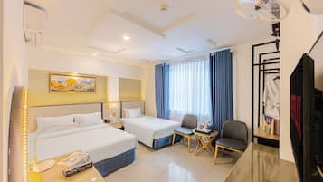 Family Room | Minibar, in-room safe, blackout drapes, iron/ironing board