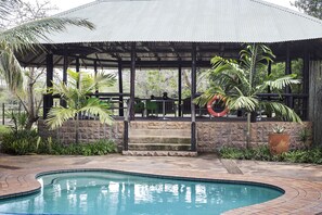 Outdoor pool, pool umbrellas, sun loungers