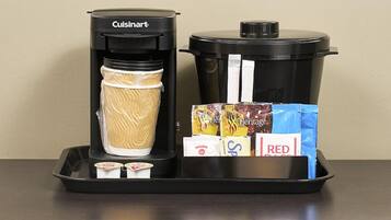 A Cuisinart coffee maker and a slow cooker on a tray.