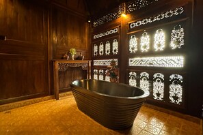 Suite, 1 King Bed | Bathroom | Shower, free toiletries, hair dryer, bathrobes