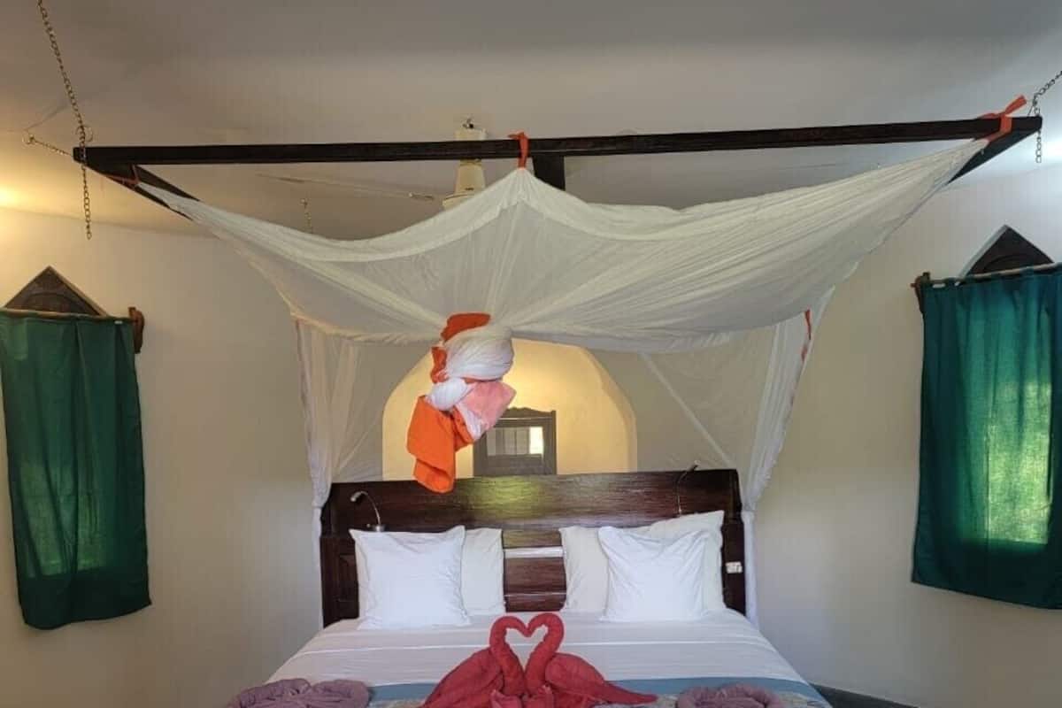 Family Room | In-room safe, individually decorated, bed sheets