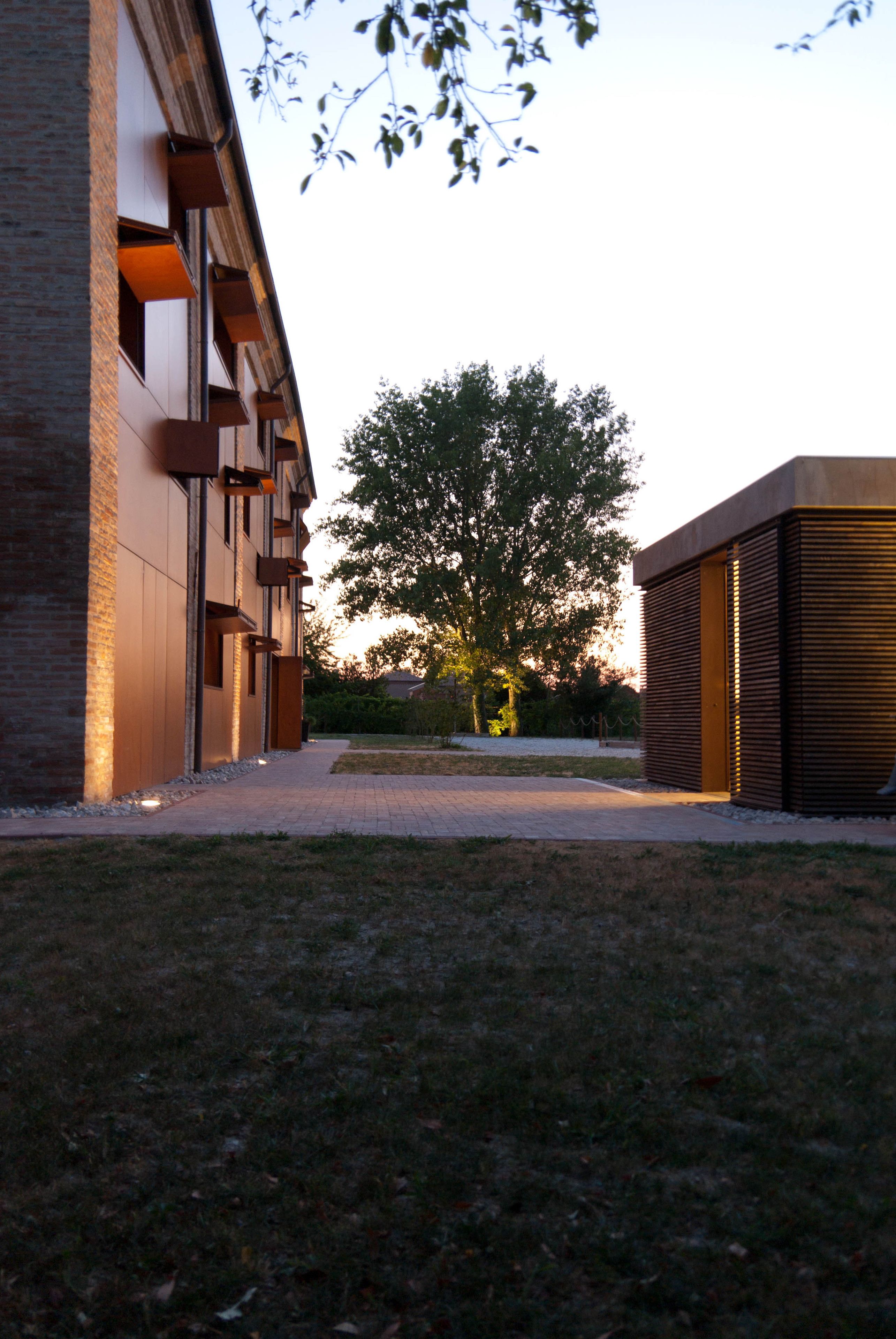 A modern building with a brick facade and large windows.